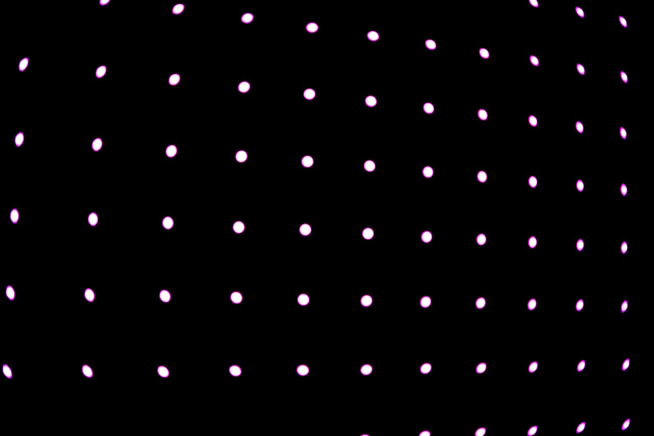 Abstract image featuring a grid of glowing pink dots on a black background creating a vibrant pattern.